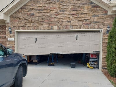 Garage door off track that needs repair in Winston-Salem