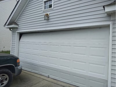 Damaged garage door panels in Summerfield NC