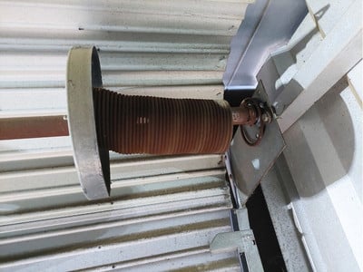 Broken mini-warehouse door spring in Greensboro NC